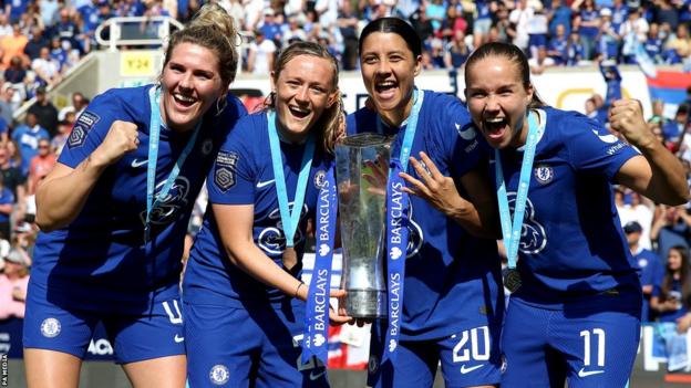 Chelsea players hold trophy