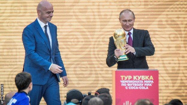 Fifa president Gianni Infantino and Russia president Vladimir Putin with the World Cup