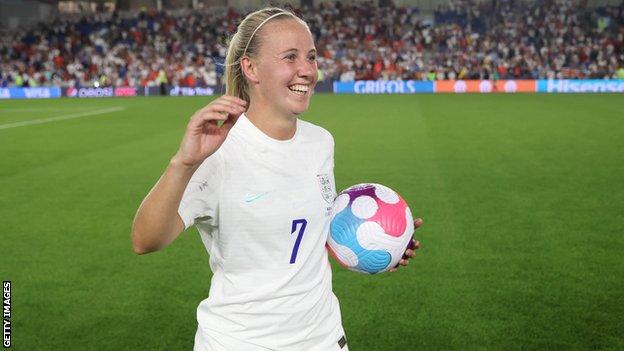 Beth Mead holds the match ball after scoring a hat-trick against Norway