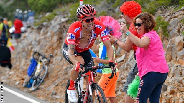 Nicolas Roche is cheered on by some colourful fans during last year's Vuelta a Espana
