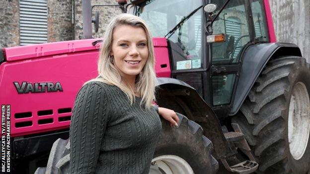 Ellie Pacey and her hot pink Valtra tractor.