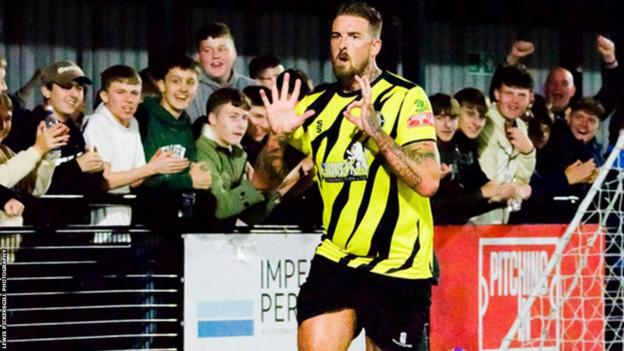 Liam Hughes celebrates scoring his 50th goal for Worksop Town in a 2-0 win over Matlock Town in the Northern Premier League Premier Division