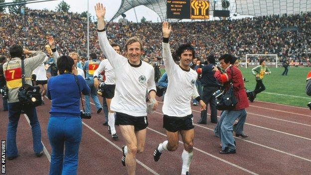 Hans-Georg Schwarzenbeck and Gerd Muller (right) celebrate winning the World Cup