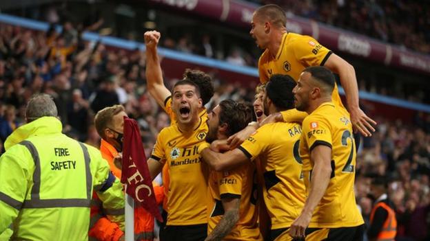 Ruben Neves celebrates scoring for Wolves at Aston Villa