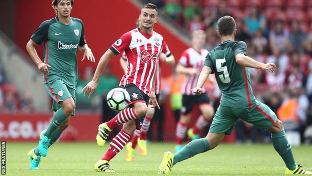Dusan Tadic (centre) in action for Southampton against Watford