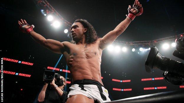 Benson Henderson celebrates on top of the cage