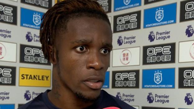 Wilfried Zaha: Crystal Palace forward someone has to break his leg to get a card - BBC Sport