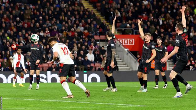 Che Adams (centre left) scores for Southampton against Lincoln