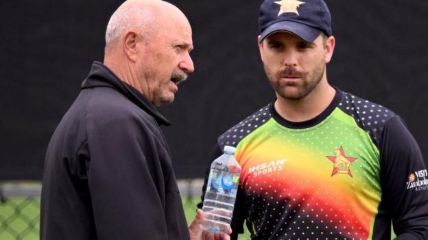 Zimbabwe coach Dave Houghton, left, talks to all rounder Ryan Burl