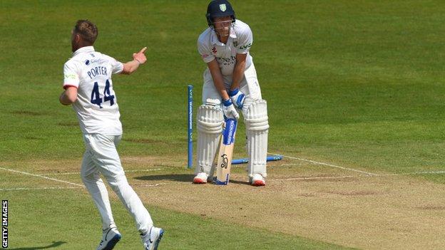 Jamie Porter celebrates taking the wicket of Cameron Bancroft