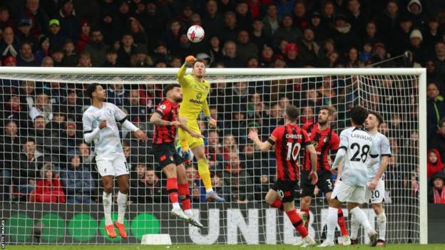 Neto punches the ball clear during Bournemouth's win over Liverpool in March