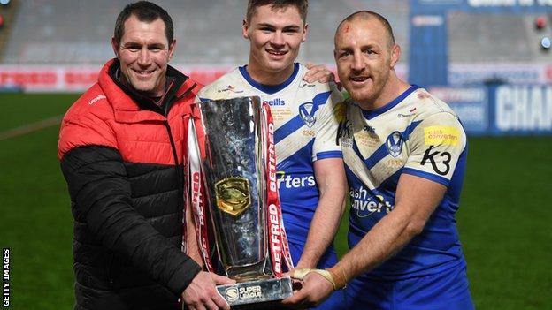Kristian Woolf, head coach of St Helens (L), try-scorer Jack Welsby and James Roby of St Helens pose with the trophy following victory during the Super League Grand Final