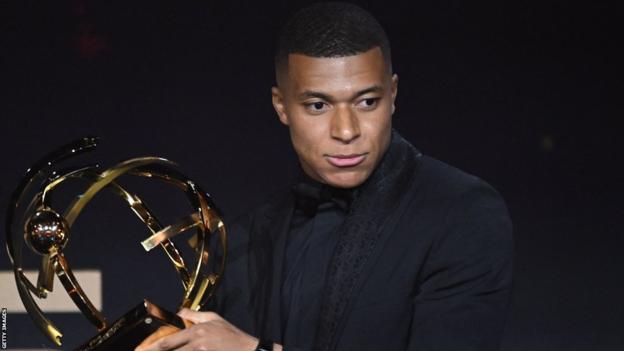 Kylian Mbappe poses with the Best Ligue 1 player award in 2023