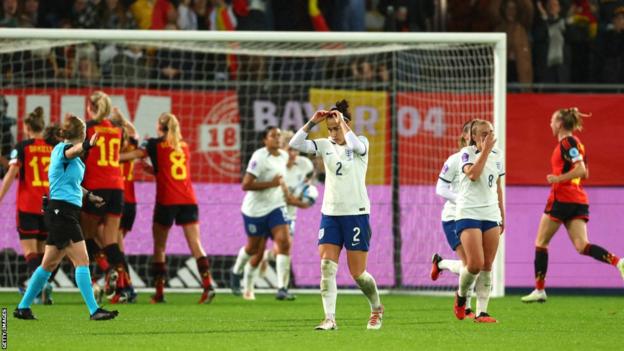 England players react to conceding a third goal in Belgium