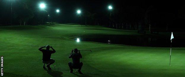 George Coetzee and Dylan Frittelli of South Africa react as they make their attempt on the Guinness World Record for the fastest hole of golf at the Turkish Airlines Open