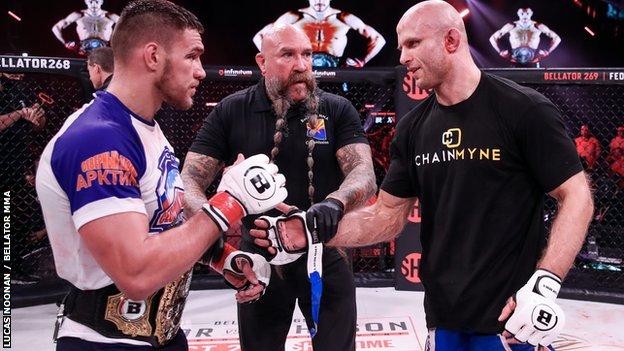 Vadim Nemkov and Julius Anglickas shake hands after their fight