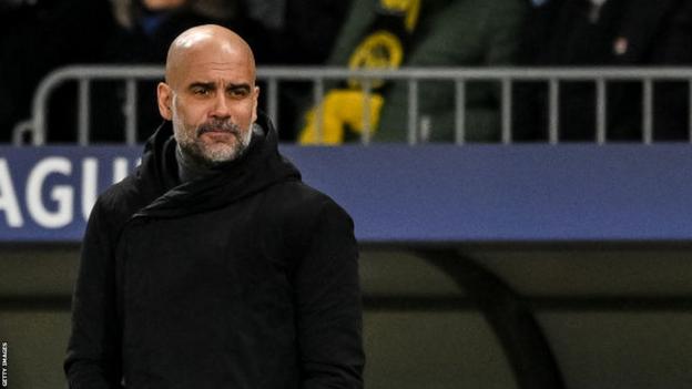 Manchester City manager Pep Guardiola looks on during a Champions League game