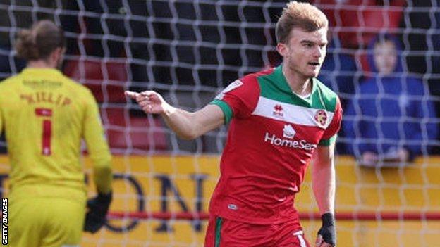 George Miller celebrates scoring for Walsall