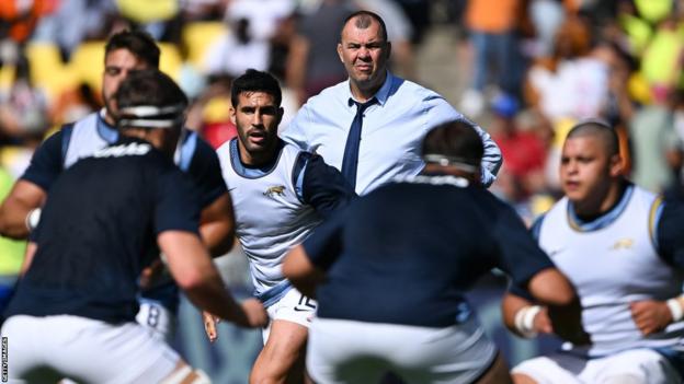 Argentina coach Michael Cheika watches his players warm up before facing Chile