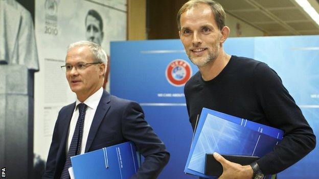 Uefa's Giorgio Marchetti and PSG boss Thomas Tuchel