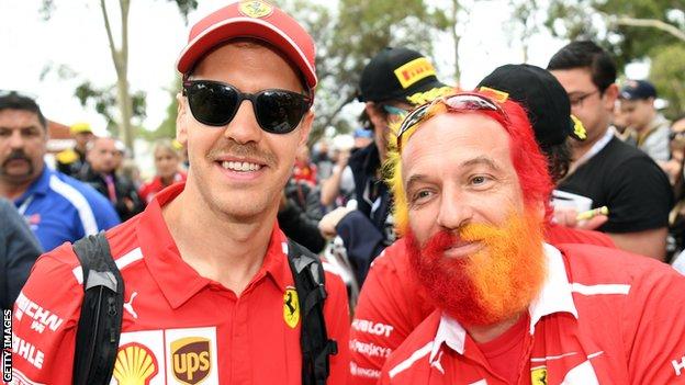 Sebastian Vettel and a fan with a multi-coloured beard
