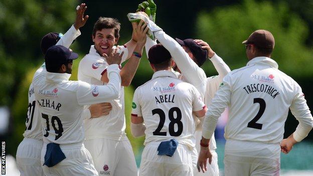 Somerset bowler Jamie Overton celebrates taking a wicket against Worcestershire