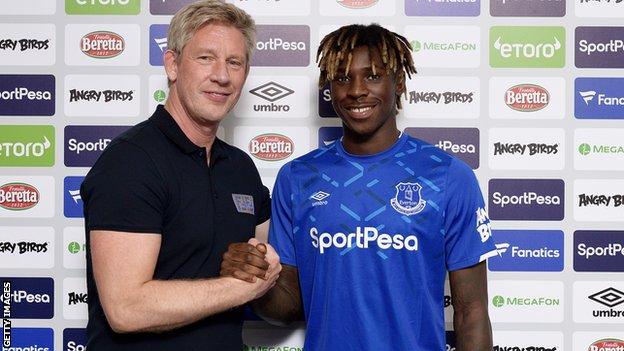 Forward Moise Kean with Everton director of football Marcel Brands