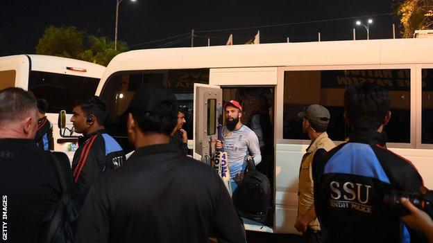 England all-rounder Moeen Ali steps off a bulletproof mini-bus in Pakistan