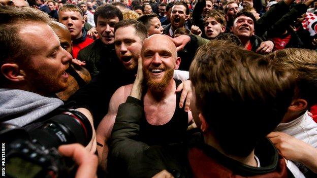 Jonny Williams is mobbed by Charlton fans after their League One Play-off semi-final win over Doncaster