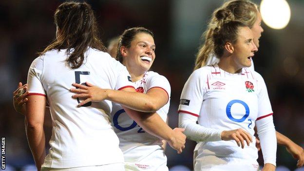 Helena Rowland celebrates with England team-mates