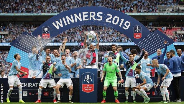 Manchester City celebrate with the FA Cup at Wembley