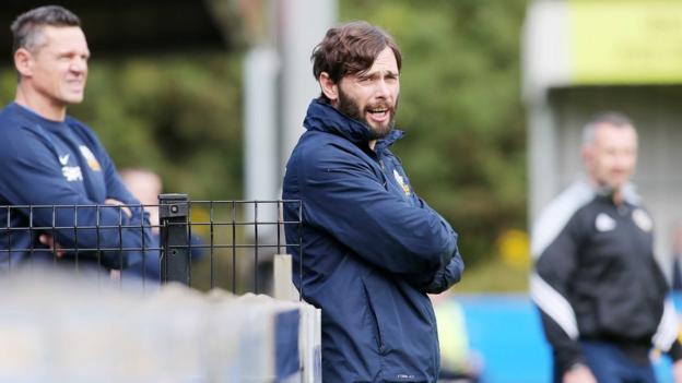 Glenavon manager Gary Hamilton looks on as his side canter to a second successive league win within the space of three days at Milltown