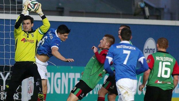 Glentoran keeper Elliott Morris makes the save as Linfield attack