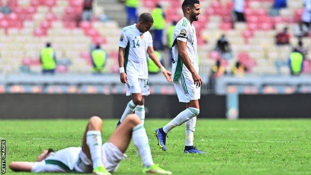 Algeria players react at full-time of their match against Sierra Leone