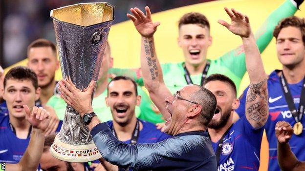 Former Chelsea manager Maurizio Sarri lifts the Europa League trophy