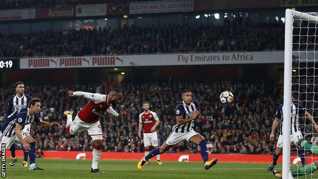 Alexandre Lacazette heads in against West Brom