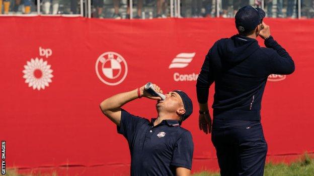 Justin Thomas drinking a beer at the Ryder Cup