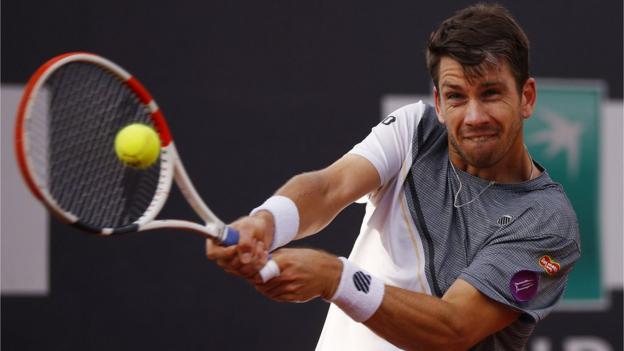 Cameron Norrie plays a shot in Rome