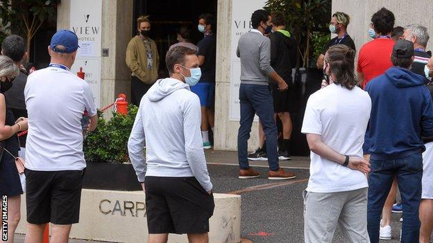 Players queue for a coronavirus test at a hotel in Melbourne