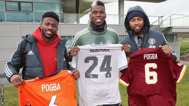 Manchester United star Paul Pogba swapped shirts with Emmanuel Sanders (l) and Josh Norman (r) when they visited United's training ground