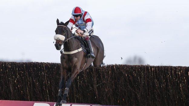 Aidan Coleman riding Saint Calvados clear the last to win The Betfred Mobile Novices' Limited Handicap Chase at Newbury