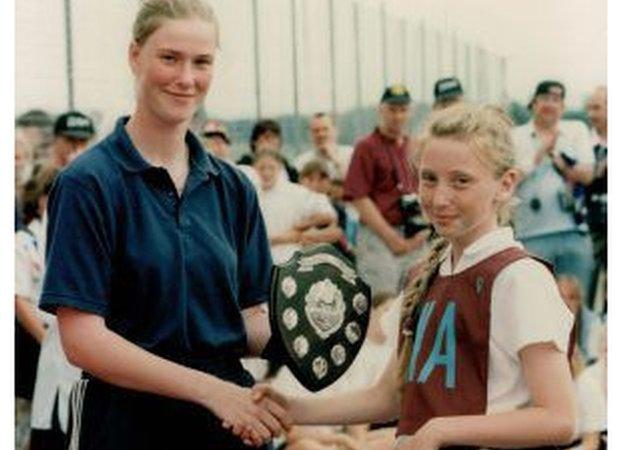 Jade Clarke winning a trophy at Trafford Netball Club, her first club