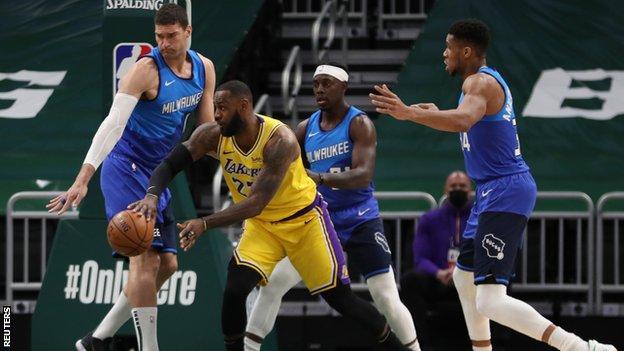 LeBron James (second left)