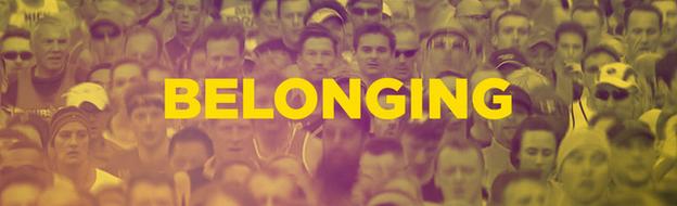 Runners in a mass partipation race with the word 'belonging' superimposed