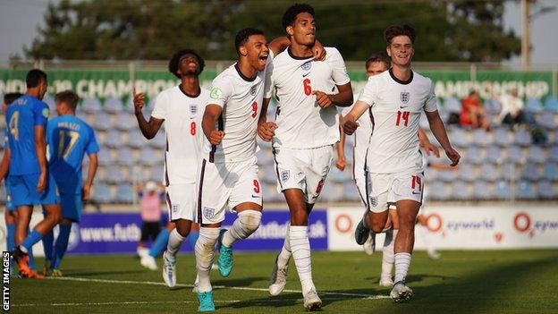 England's players celebrate scoring against Italy in the European Under-19 Championship semi-final