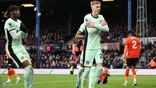 Cole Palmer celebrates scoring against Luton Town