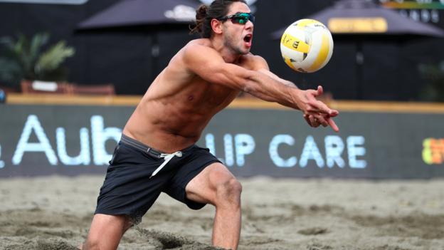 ISSAQUAH, WASHINGTON - JUNE 21: Raffe Paulis sets the ball while competing against Taylor Crabb and Jake Gibb during the AVP Seattle Open at Lake Sammamish State Park on June 21, 2019 in Issaquah, Washington. (Photo by Abbie Parr/Getty Images)