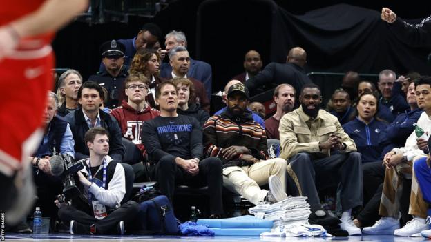 Dallas Mavericks owner Mark Cuban, Kyrie Irving and Tim Hardaway Jr watching the Chicago Bulls game courtside