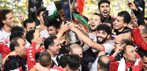 Tunisia celebrate with the Kirin Cup