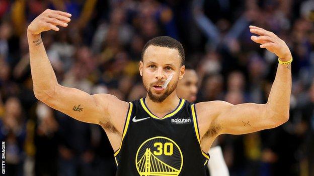Stephen Curry celebrates the Golden State Warriors' win over the Denver Nuggets in the NBA pay-offs